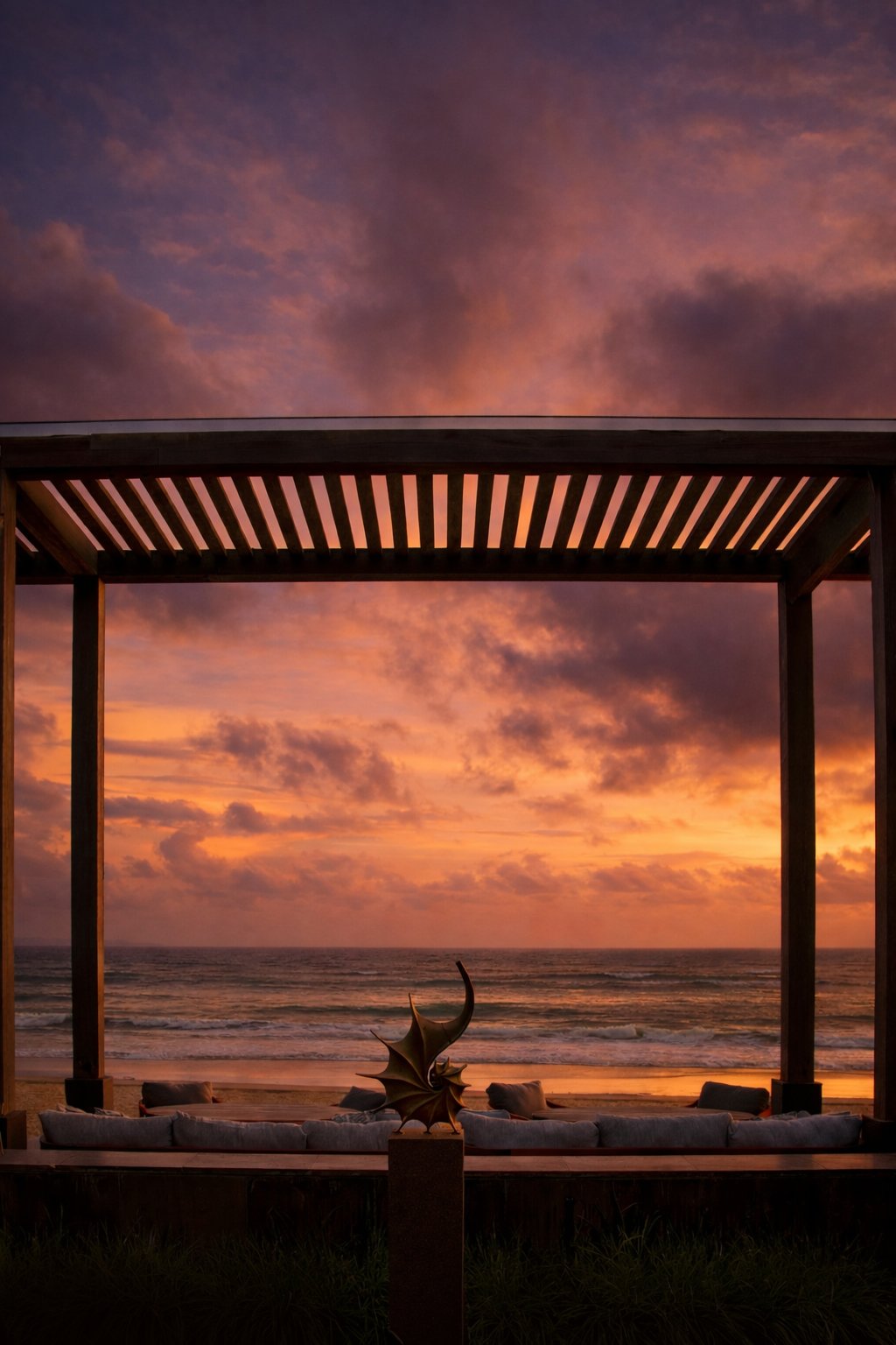 Sunset view from the open-air lounge at CURE Bali overlooking the ocean
