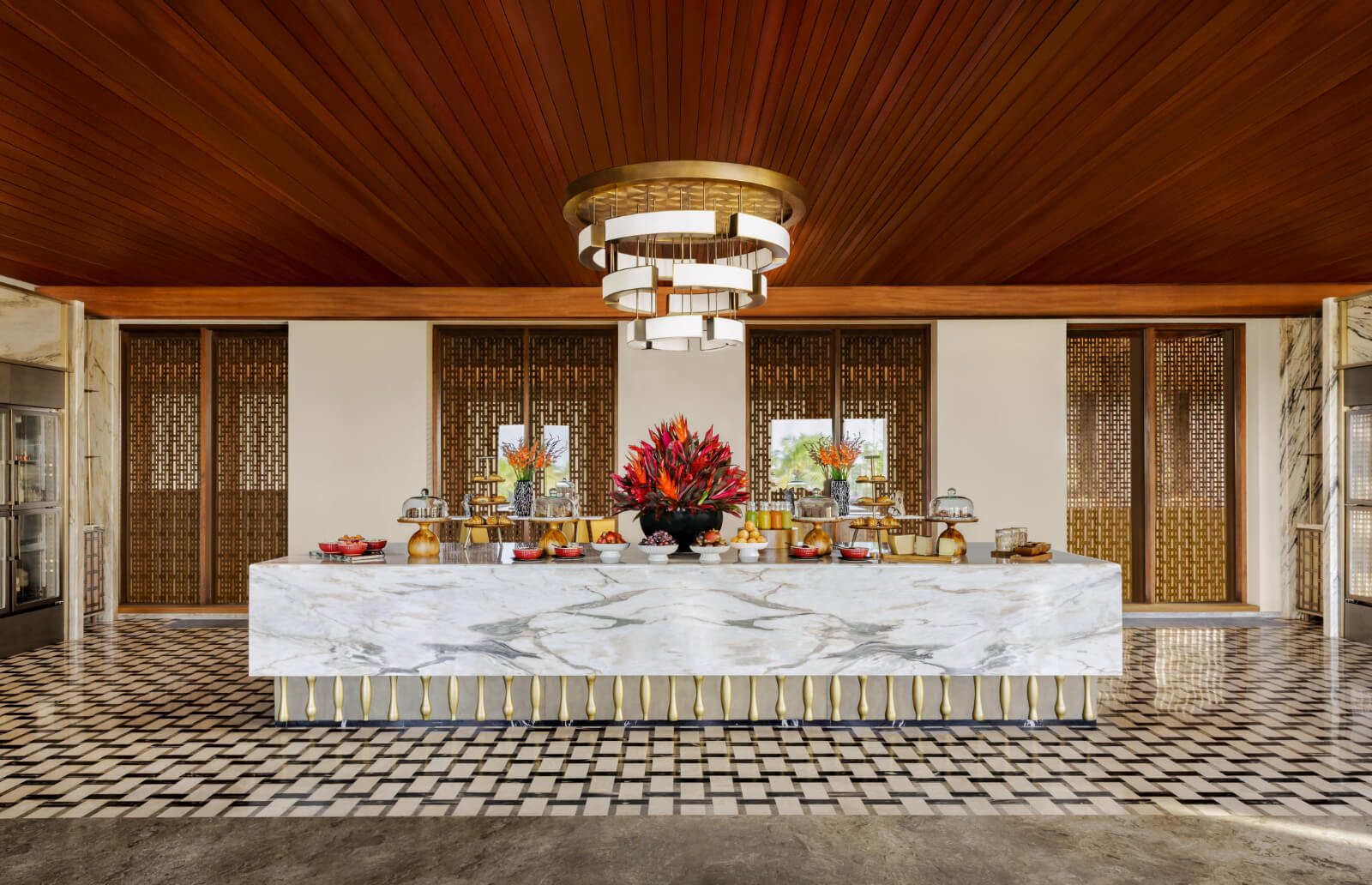 Elegant Regent Club lounge with a curved bar and intimate seating at Regent Bali Canggu